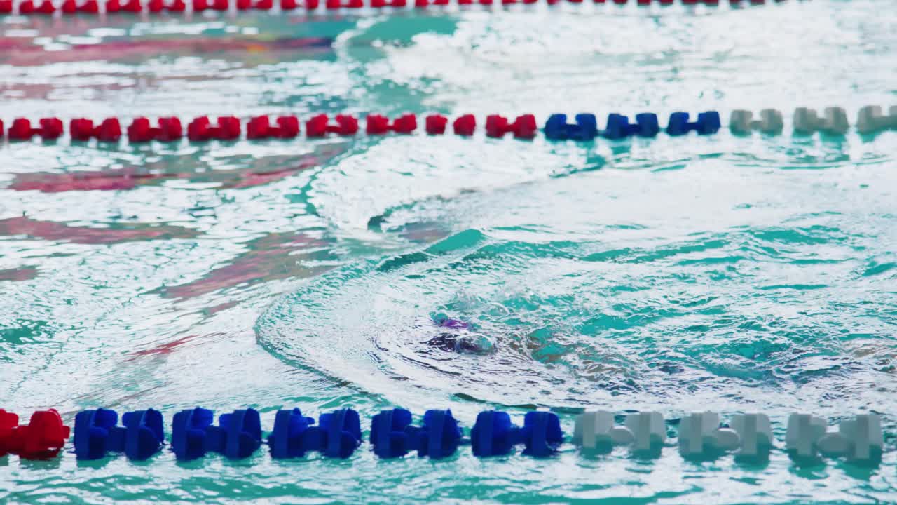 Competitive Swimming: A Dedicated Athlete in Motion, Showcasing Technique and Determination During a Swim Practice Session in a Dynamic Training Environment