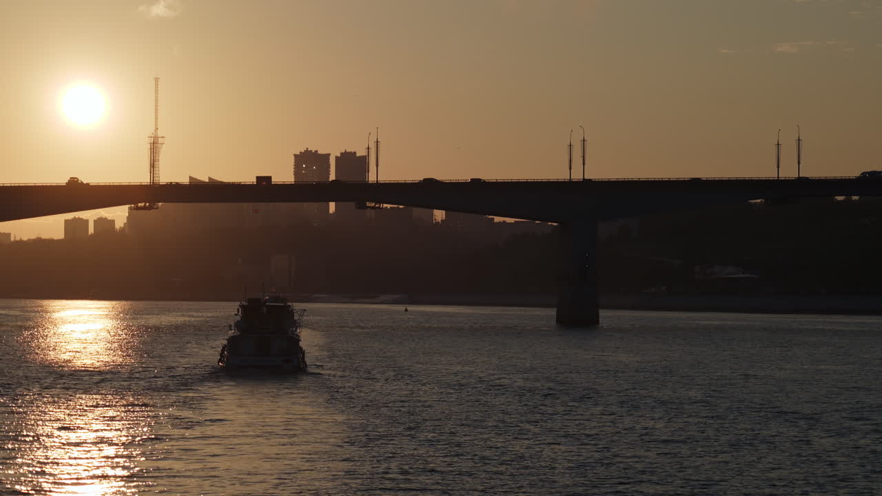 Sunset over River with Bridge and Boat