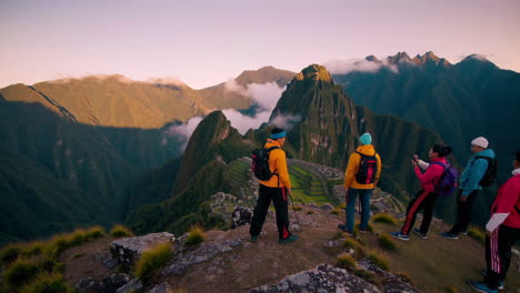 hikers at machu picchu sunrise