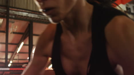 two female boxers practicing in boxing ring