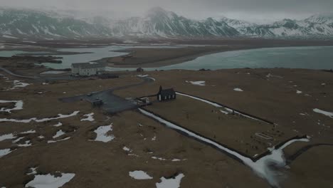 cinematic aerial view of famous landmark church building in iceland