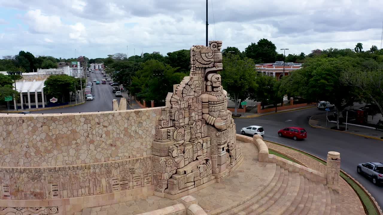 Closeup aerial descent on side of the Monument a la Patria, Homeland Monument on the Paseo de Montejo in Merida, Yucatan, Mexico