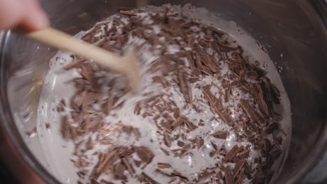 mixing delicious dark chocolate with coconut milk, baking a yummy chocolate oat cake - steady shot