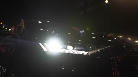 close up of details of switched on headlights of anonymous prestigious luxury modern car. concept of passion for driving cars and engines, car dealerships, used cars,luxury cars, auto dial