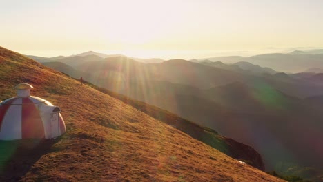 drone 4k clip of batrana mountain refuge high at 2170m in bucegi mountains, romania, on a beautiful autumn day