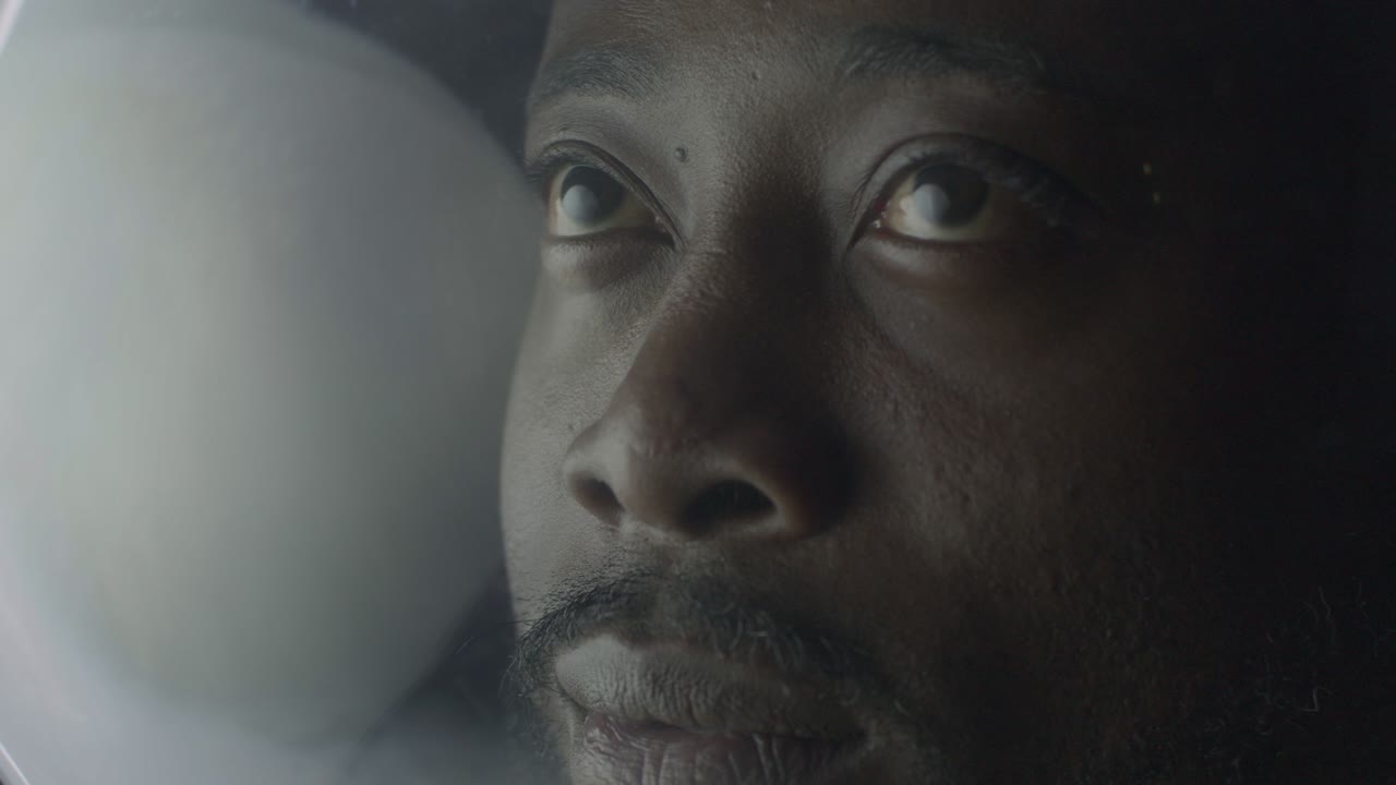Happy smiling astronaut man in helmet, outer space exploration