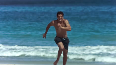 Young-man-running-in-slow-motion-in-shorts