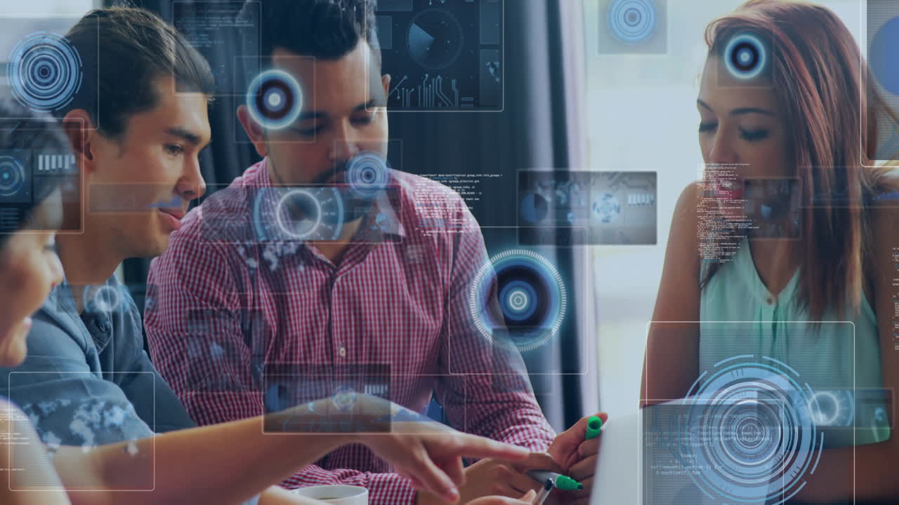 Coworkers collaborating on tech around laptop, highlighting floating data charts with green marker