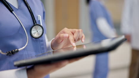 hospital, research and hands of doctor on tablet