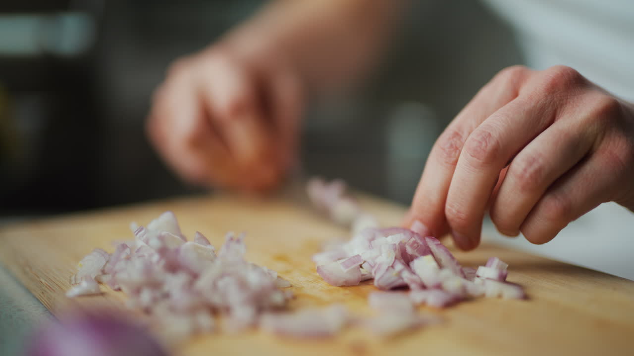 Close-Up Of Onion Cut Into Cubes On Wooden Chopping Board