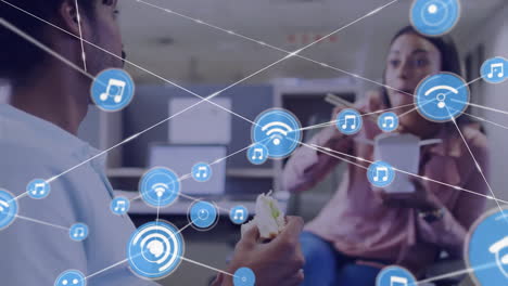 animation of network of connections over diverse colleagues eating takeaway food in office