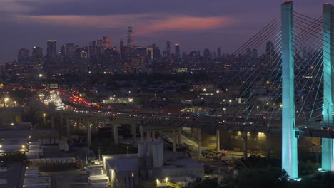 Aerial view of New York City&#039;s Kosciuszko Bridge at night. The bridge spans Newton Creek connecting Queens and Brooklyn