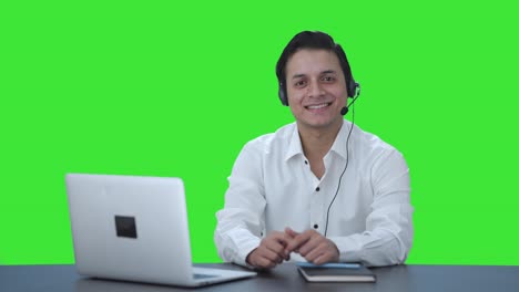 Happy-Indian-call-center-employee-smiling-Green-screen
