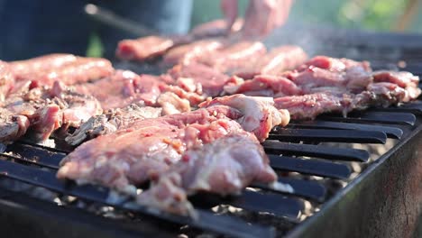 Grilling-Pork-Meat-Outside-The-Backyard.-Close-up-Shot