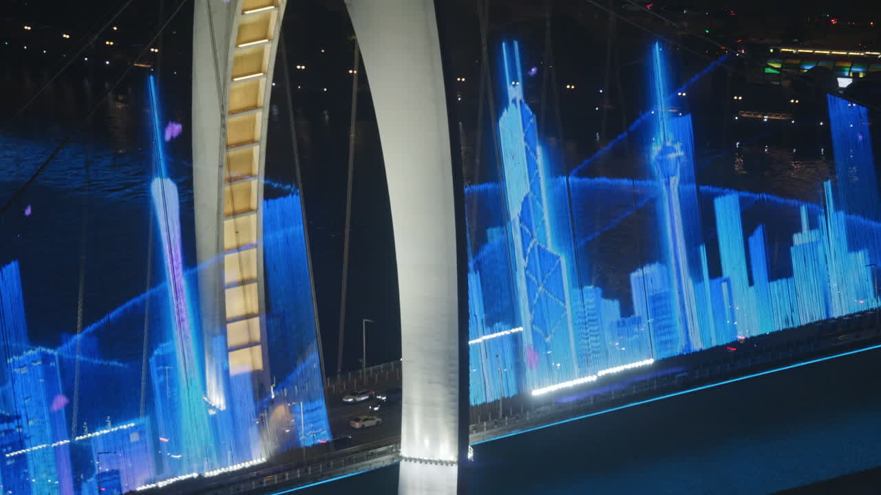 Vibrant Digital Art Displayed on a Bridge Over Water at Night