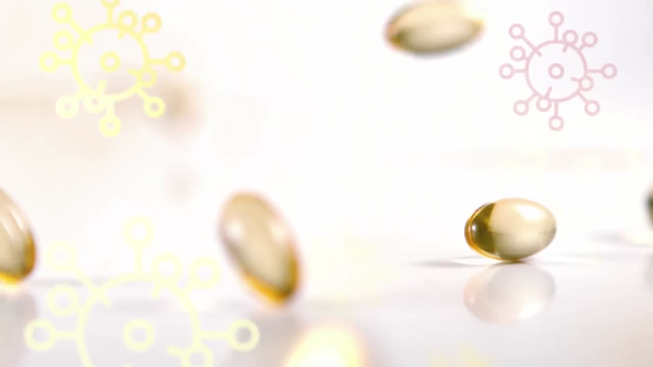 ⁇ 색 배경에 떨어지는 알약 위에 떠다니는 다채로운 코로나19 세포 아이콘의 애니메이션