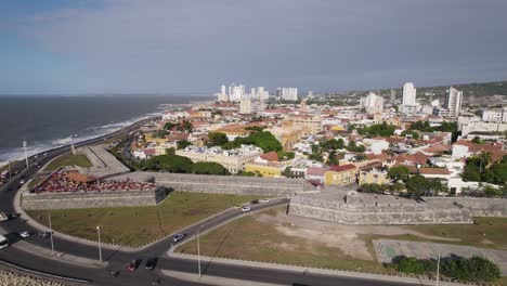 Aerial-establishing-shot-of-the-city-walls-on-show-at-the-coast-of-Cartagena