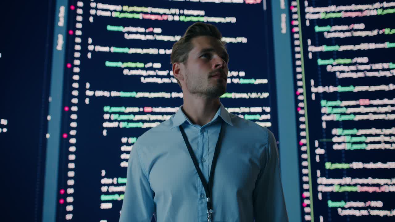 Innovative Startup Eureka Moment: Portrait of Brilliant Software Engineer Finding Solution, Doing Big Data Analysis. Big Screen Background. Computer Science Programmer Developing App.Cinematic Zoom In