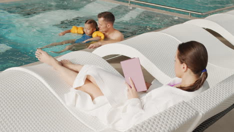 family relaxation by the pool