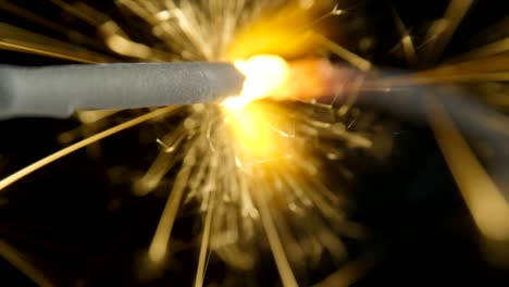 bengal fire on the dark black background, christmas sparkler