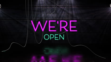 animation of we're text in pink and blue neon letters on black background