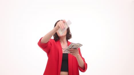 woman in red jacket throwing money