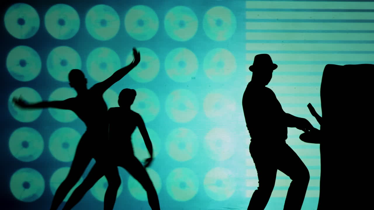 Silhouette of people performing on stage