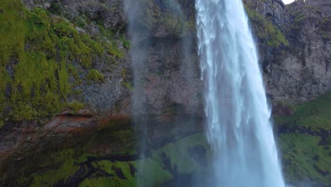 low angle slow motion shot of waterfall in iceland