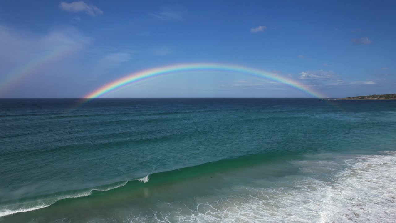 Bay Of Fires And Beach With Rainbow In Tasmania, Australia - Aerial Pullback