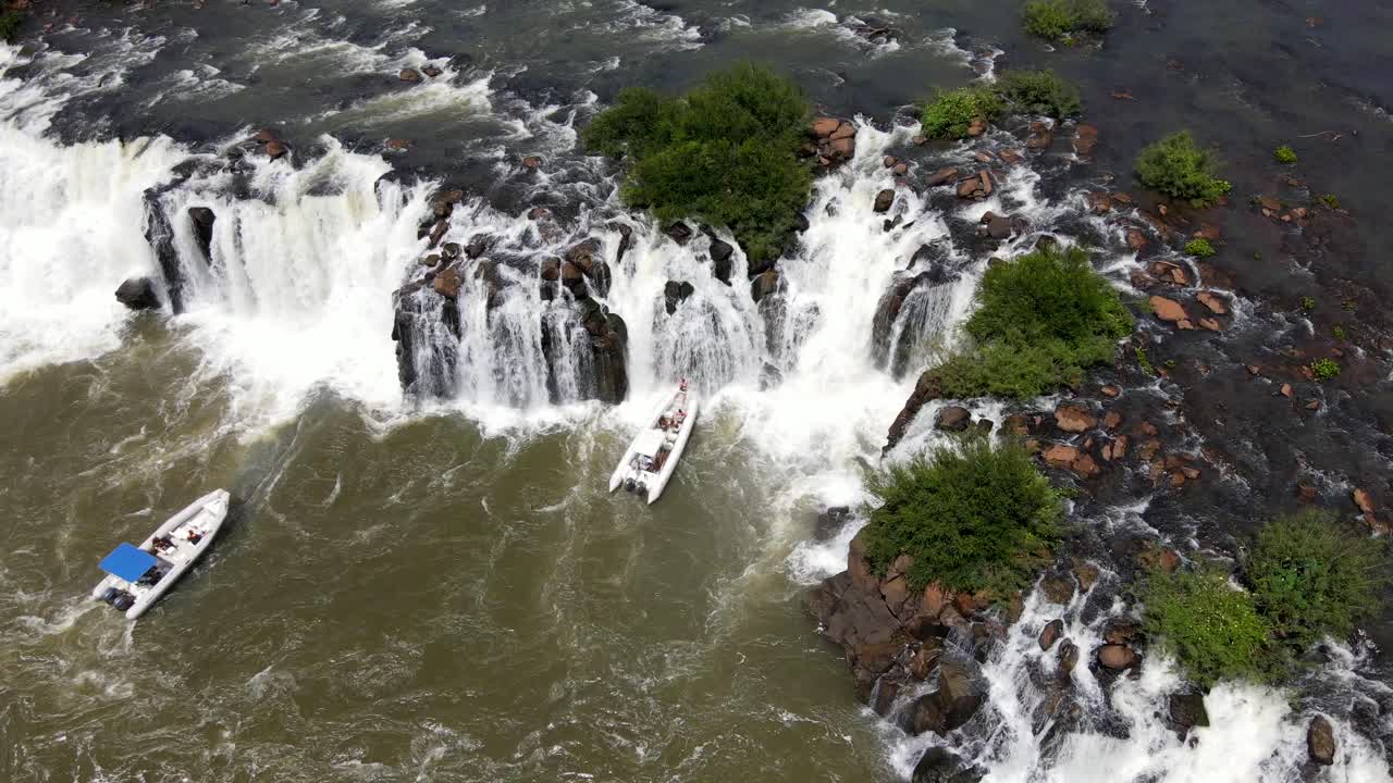 Two Semi-rigid Tours Boats Contemplating in the Turbulent waters Mocon&aacute; Waterfalls