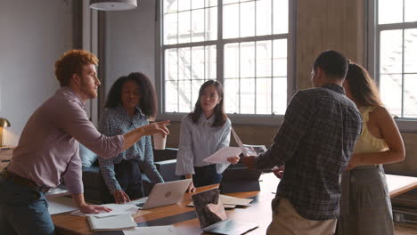 young creatives brainstorming ideas together at work