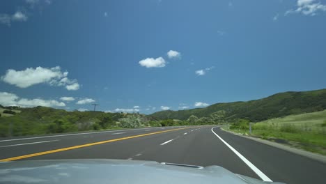 Driving-through-beautiful-scenery-on-a-sunny-day-in-California,-USA