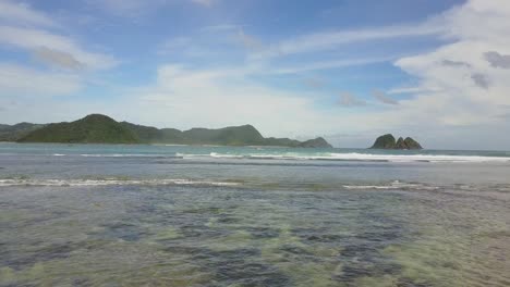 A-remote-surf-beach-at-Pantai-Selong-Belanak,-Lombok,-Aerial-shots-during-day-light