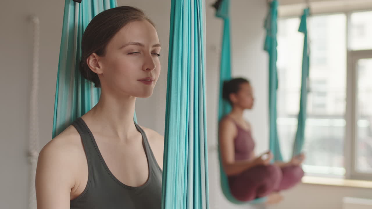 Woman Doing Aerial Yoga Position