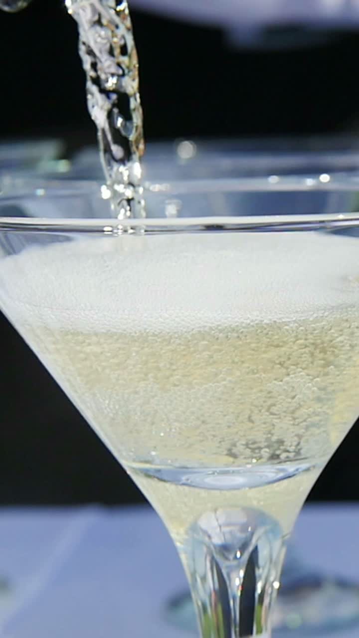 Pouring Champagne into Martini Glasses