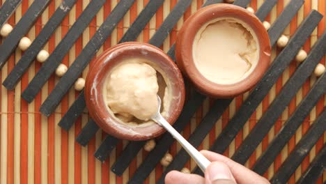 delicious indian custard dessert in clay pots