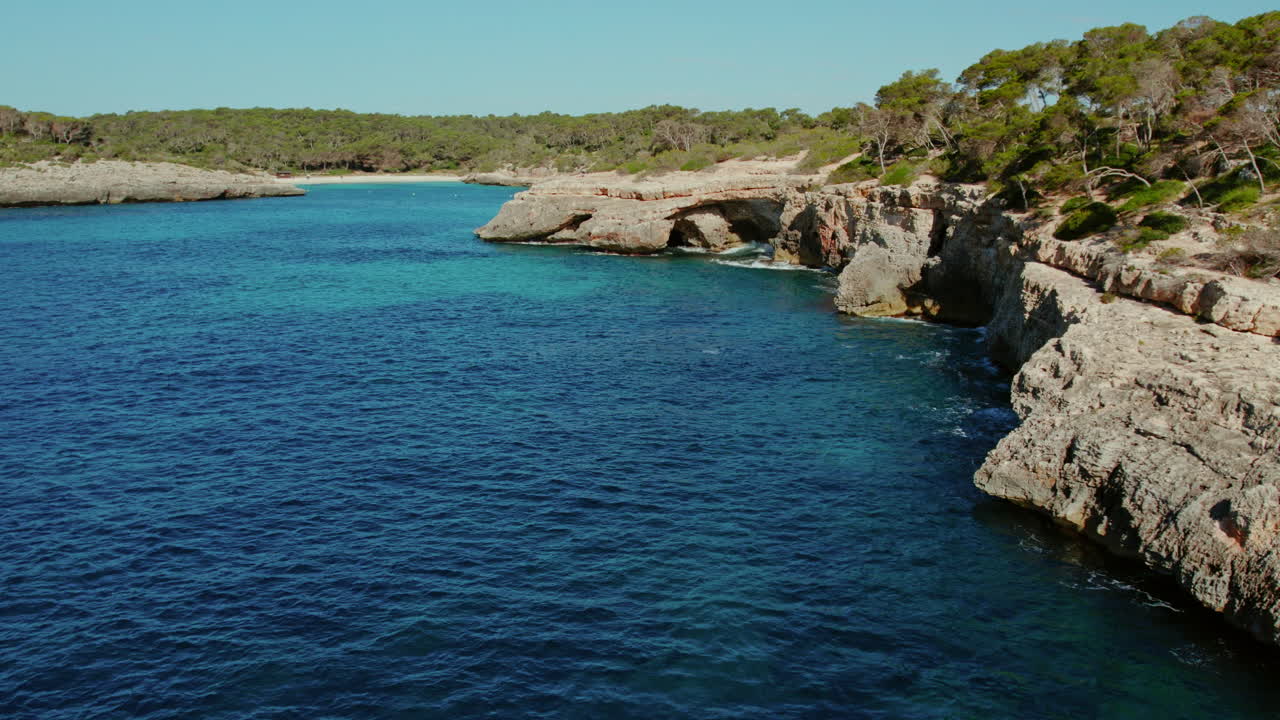 Crystal Clear Water And Rocky Cliffs Along Cala Mondrago And S'Amarador Beaches In Mallorca, Spain