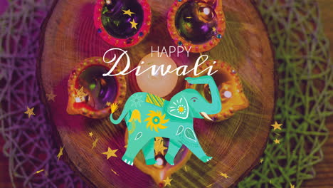 animación del feliz texto de diwali sobre velas tradicionales y un elefante