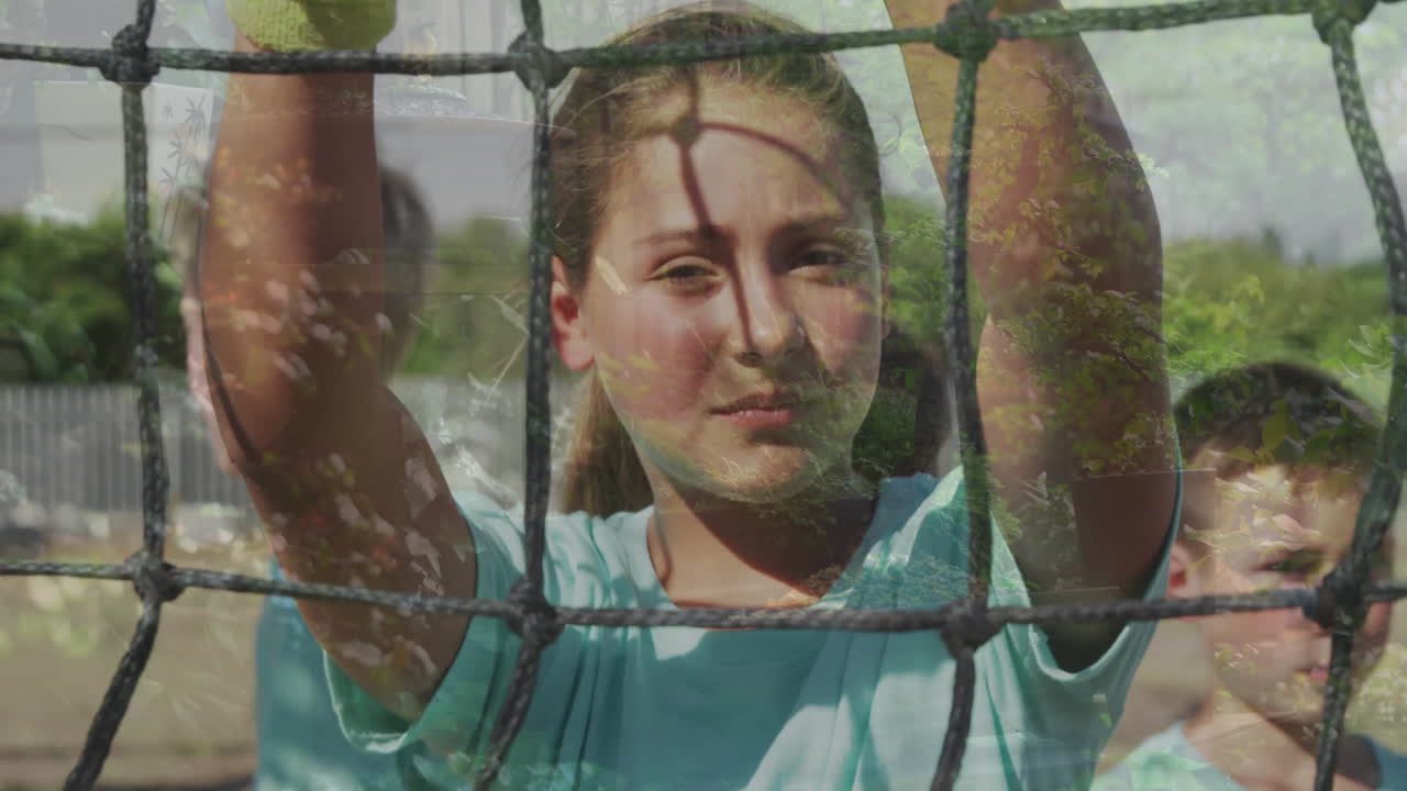 Behind soccer net, child looking determined during outdoor game animation