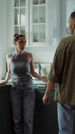 couple arguing in kitchen