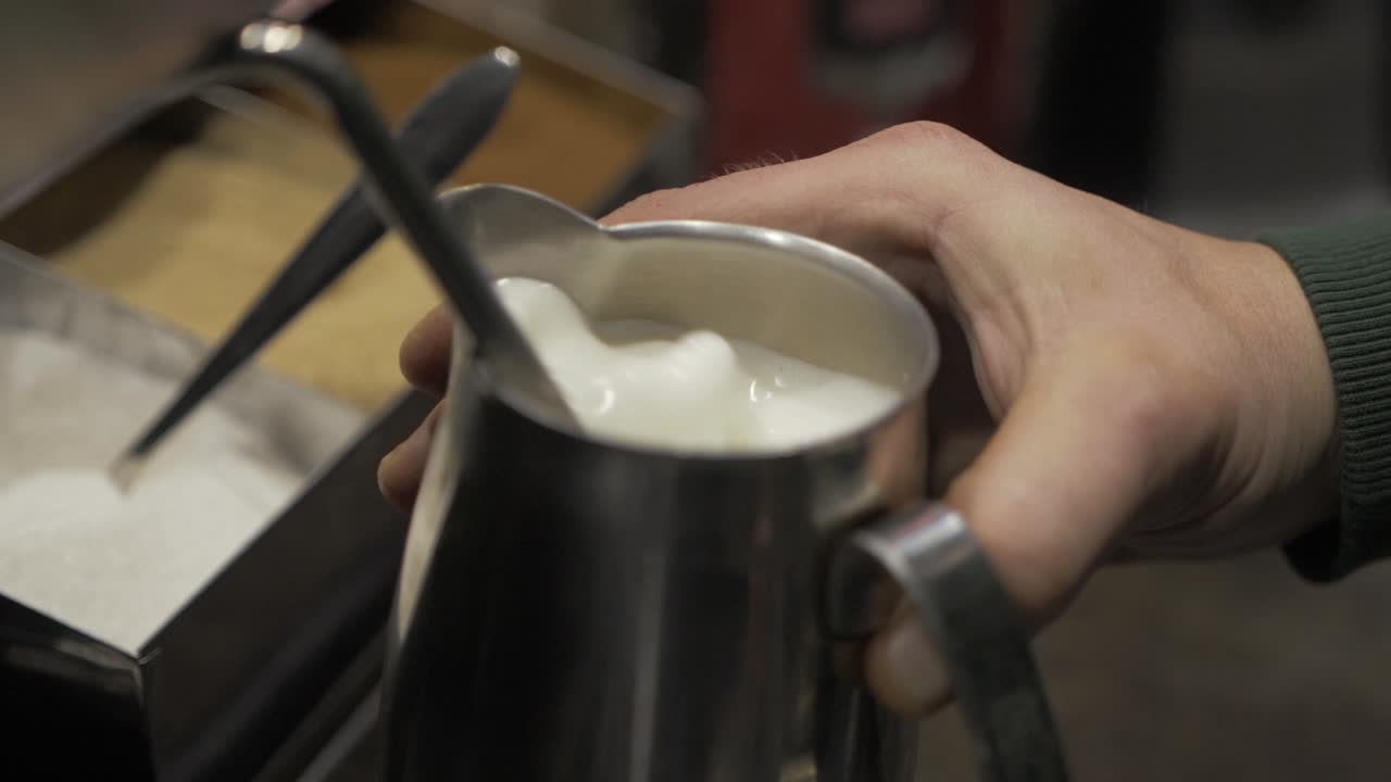 Milk Being Frothed at a Diner For a Customers Morning Cup of Coffee