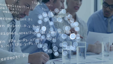 Animation of data processing and icons over diverse business people discussing work in office