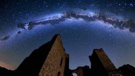 milky way over ancient castle ruins
