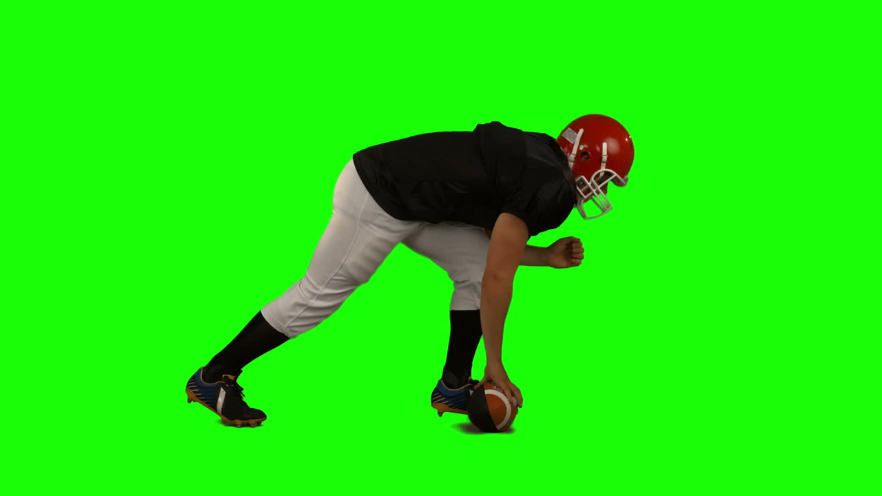 Giocatore di football americano su green screen