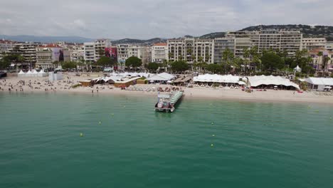 tropical beach hotel restaurants in cannes, south of france - aerial approach