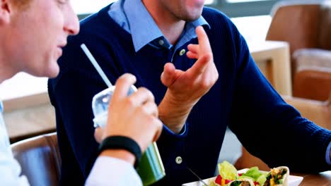 Executives-having-breakfast-together-in-the-cafeteria