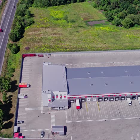 aerial view of a distribution center with loading docks and parking area