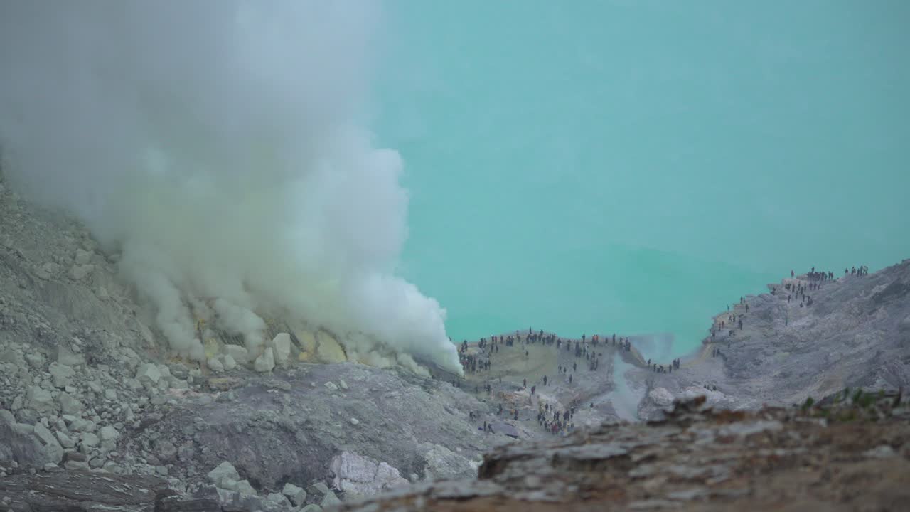 Acid lake Ijen sulfur plume toxic smoke volcano caldera nature tourist attraction Indonesia