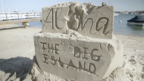 sand engraving art by the beach