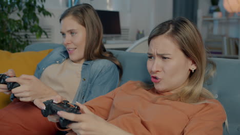 two women friends playing video games